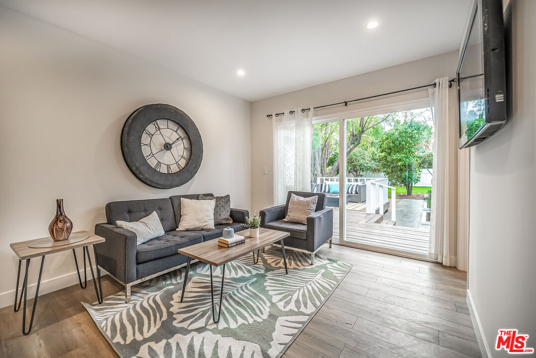 5619 Bellingham Avenue Valley Village, CA 91607 - Photo 14 of 48 a living room with furniture and a large window