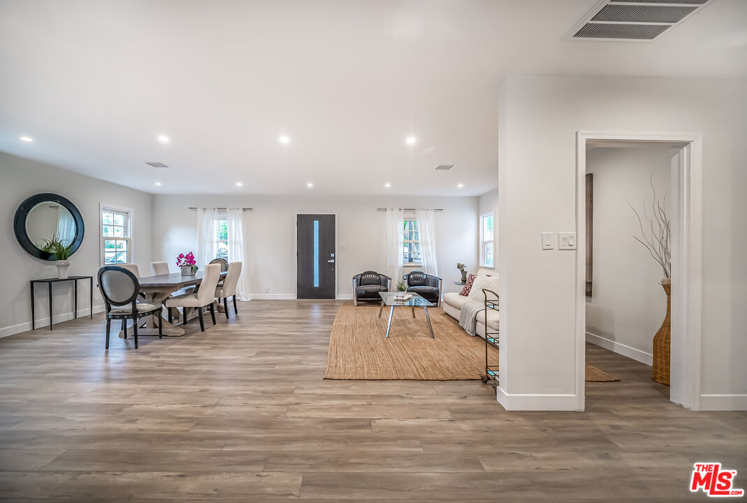 5619 Bellingham Avenue Valley Village, CA 91607 - Photo 16 of 48 a living room with furniture and a table