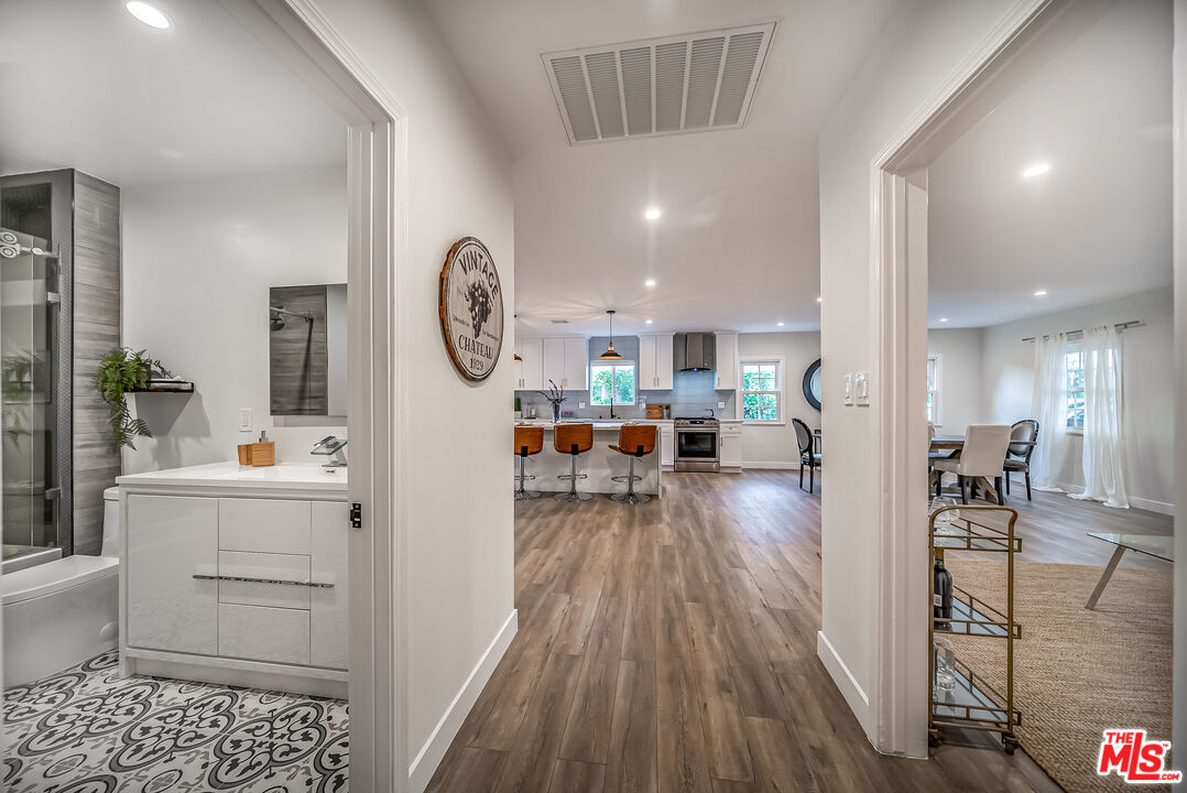 5619 Bellingham Avenue Valley Village, CA 91607 - Photo 17 of 48 a living room with furniture and a wooden floor