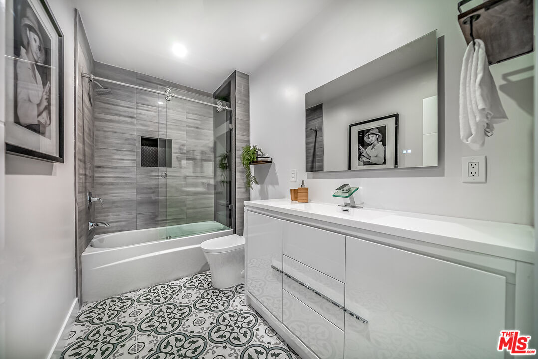 5619 Bellingham Avenue Valley Village, CA 91607 - Photo 18 of 48 a bathroom with a bathtub toilet and sink