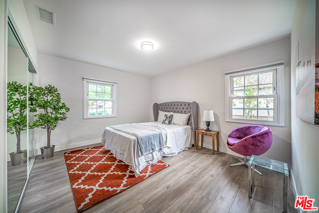 5619 Bellingham Avenue Valley Village, CA 91607 - Photo 19 of 48 a bedroom with a bed and window
