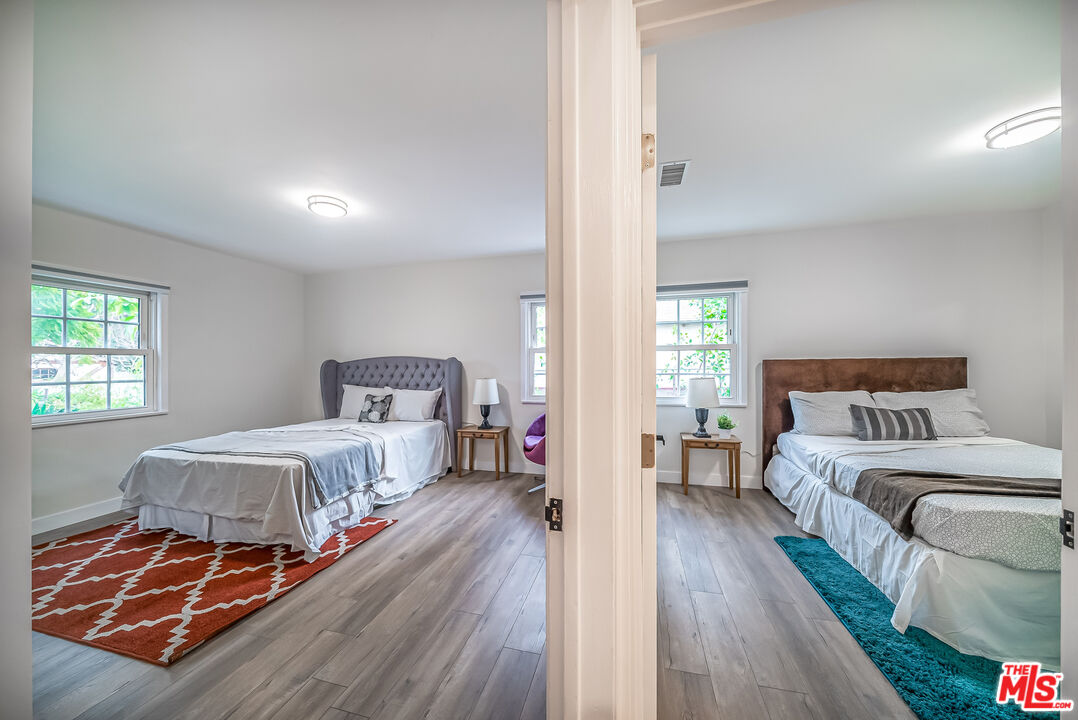 5619 Bellingham Avenue Valley Village, CA 91607 - Photo 21 of 48 a bedroom with bed and window