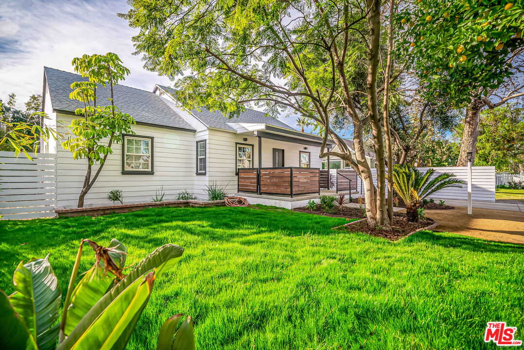 5619 Bellingham Avenue Valley Village, CA 91607 - Photo 3 of 48 a front view of a house with garden