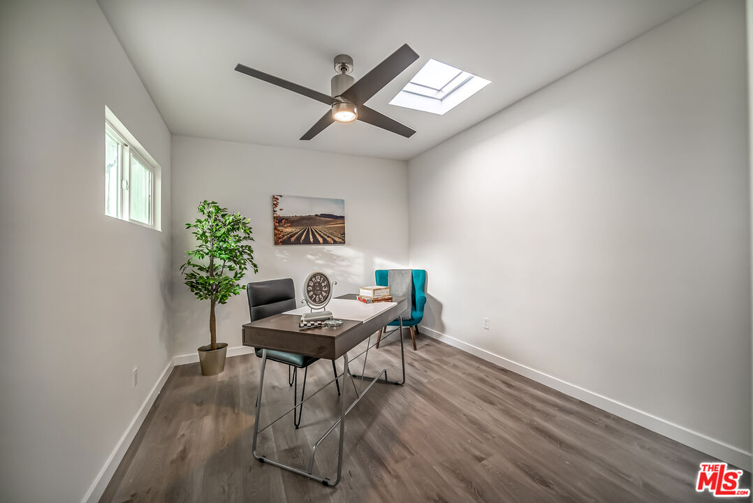 5619 Bellingham Avenue Valley Village, CA 91607 - Photo 35 of 48 a workspace with furniture and a potted plant
