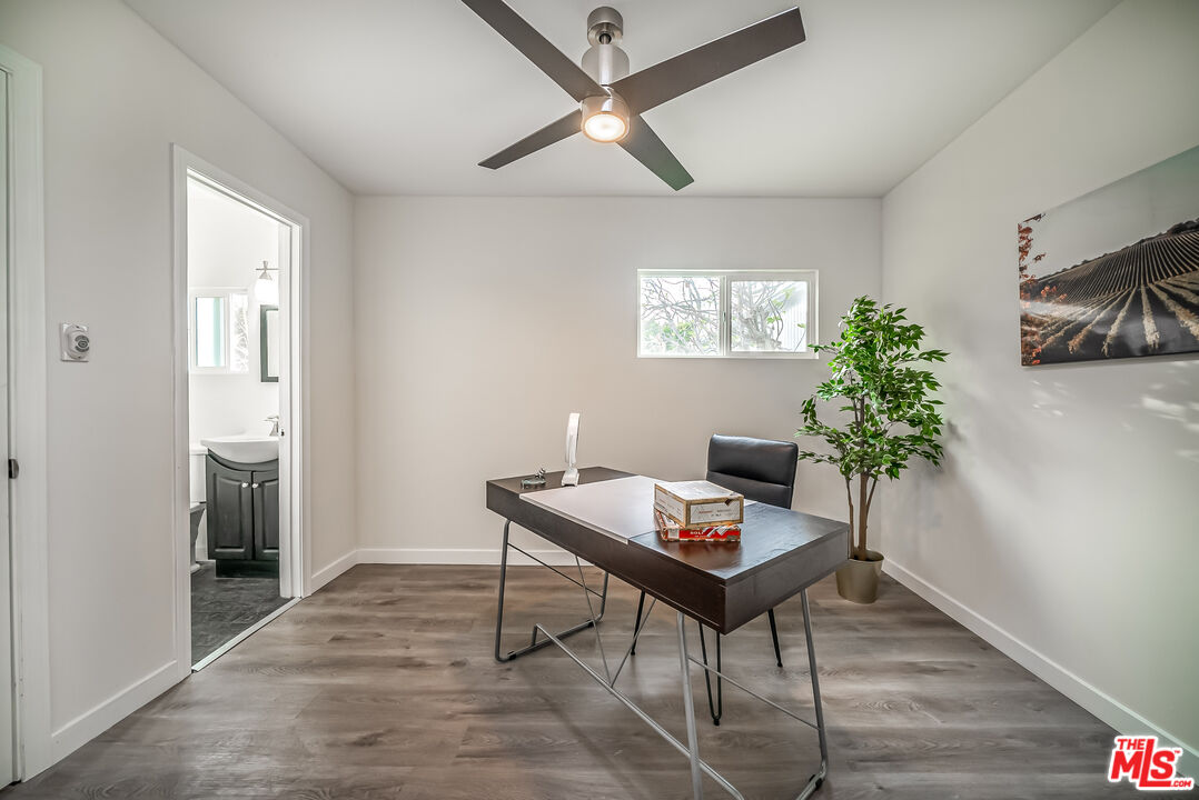 5619 Bellingham Avenue Valley Village, CA 91607 - Photo 36 of 48 a workspace with furniture and a potted plant