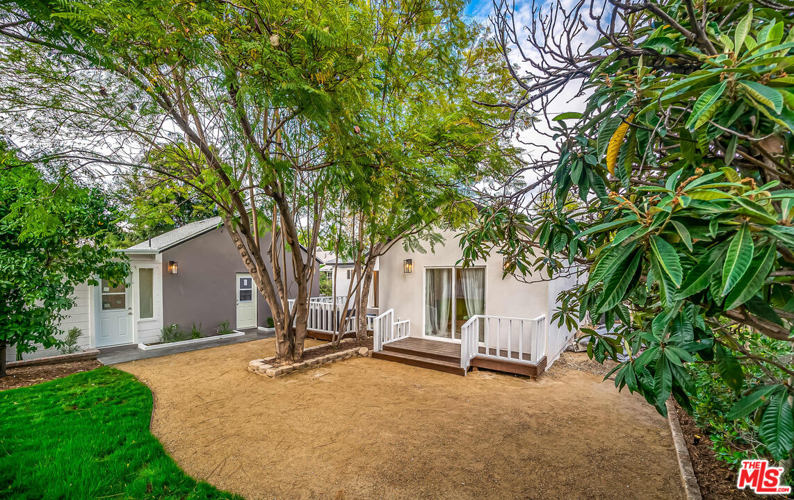 5619 Bellingham Avenue Valley Village, CA 91607 - Photo 45 of 48 a view of a house with a tree and yard