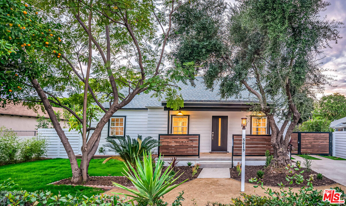 5619 Bellingham Avenue Valley Village, CA 91607 - Photo 46 of 48 a front view of a house with garden