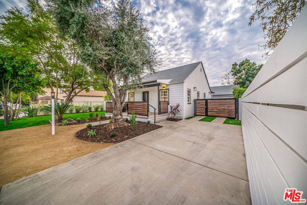 5619 Bellingham Avenue Valley Village, CA 91607 - Photo 47 of 48 a view of a house with a patio and a yard