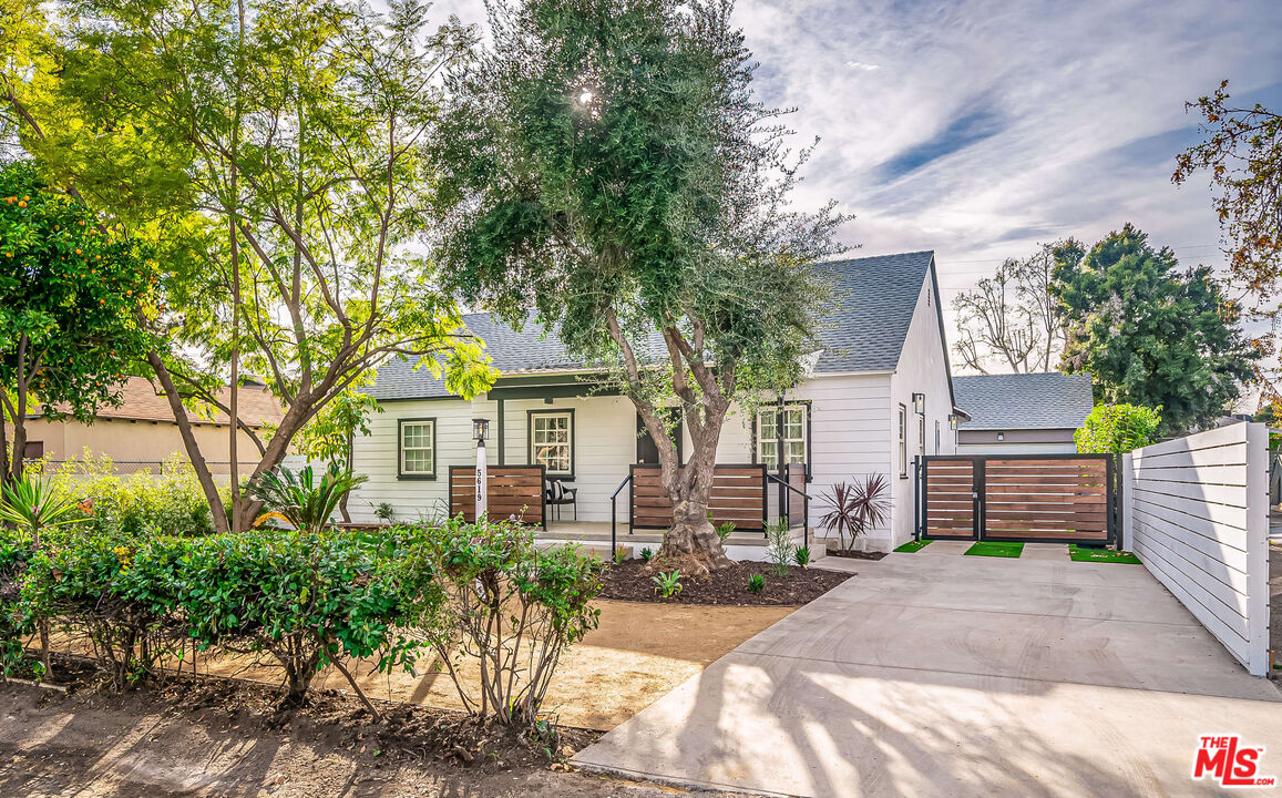 5619 Bellingham Avenue Valley Village, CA 91607 - Photo 48 of 48 a front view of a house with a garden