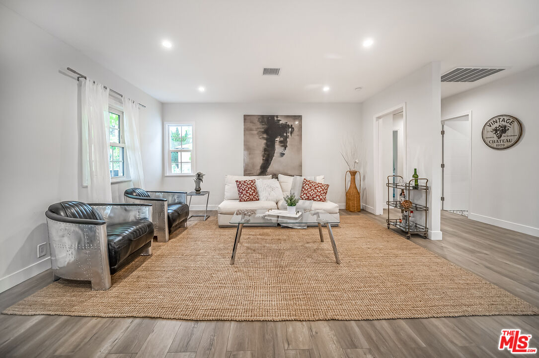 5619 Bellingham Avenue Valley Village, CA 91607 - Photo 5 of 48 a living room with furniture and a wooden floor