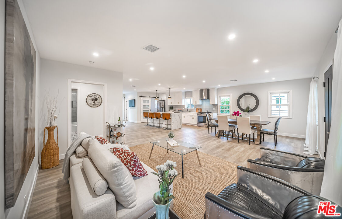 5619 Bellingham Avenue Valley Village, CA 91607 - Photo 7 of 48 a living room with furniture and a large window