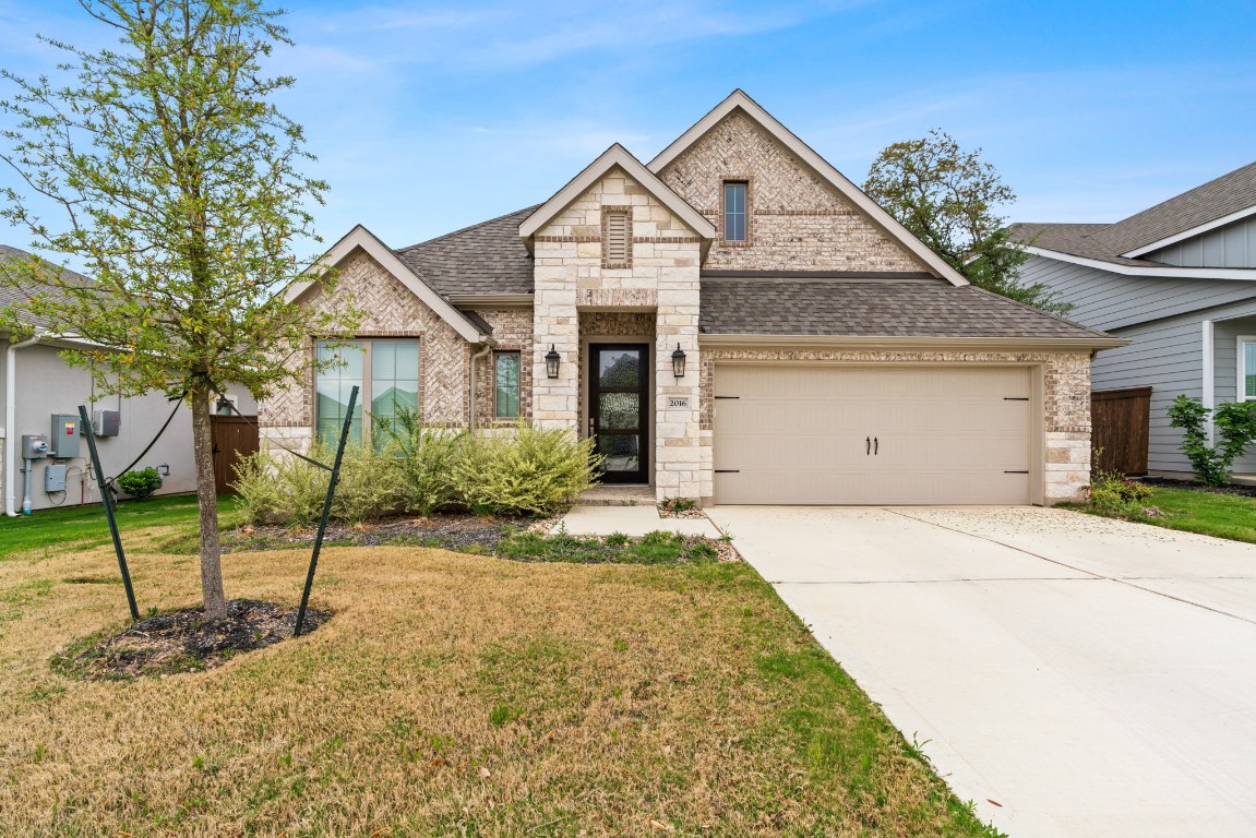 2016 Stirling Street Leander, TX 78641 - Photo 1 of 1 a front view of a house with a yard