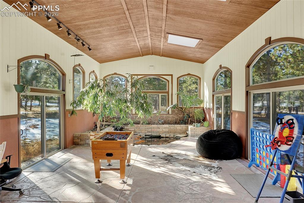 17350 Goshawk Road Colorado Springs, CO 80908 - Photo 33 of 50 a living room with furniture and a large window