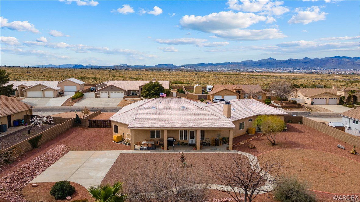 2898 Mountain Trail Road Kingman, AZ 86401 - Photo 44 of 75 an aerial view of a house with big yard and large tree