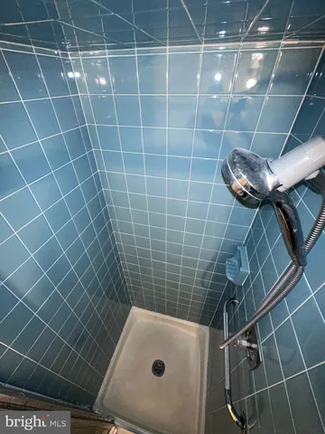 a bathroom with a sink toilet shower and bathtub