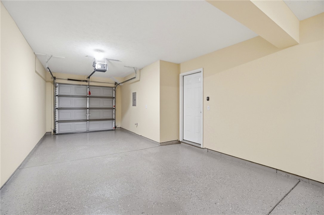 4324 Straight Arrow Road Dayton, OH 45430 - Photo 38 of 40 This spacious garage offers ample room and a durable floor for vehicles and storage.