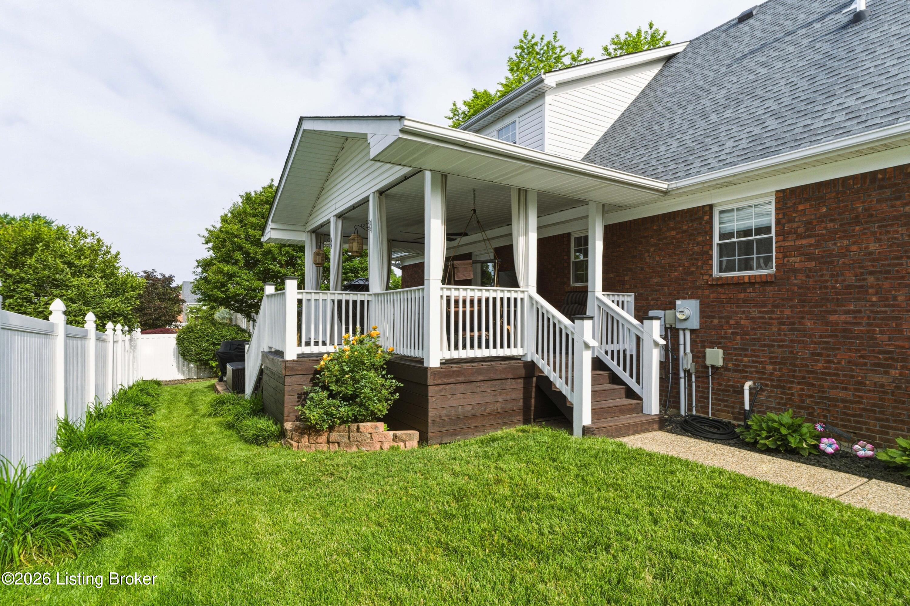 7210 Rambo Way Louisville, KY 40228 - Photo 27 of 30 Green space for play and a lovely deck for relaxing.