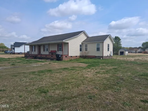 a house view with a garden space