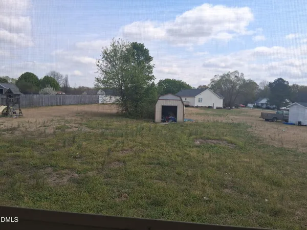 a big yard with lots of tress in it