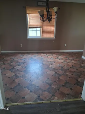 a view of room with wooden floor