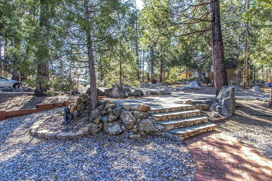 26710 Mc Mahon Road Idyllwild, CA 92549 - Photo 3 of 35 a view of a backyard with large trees