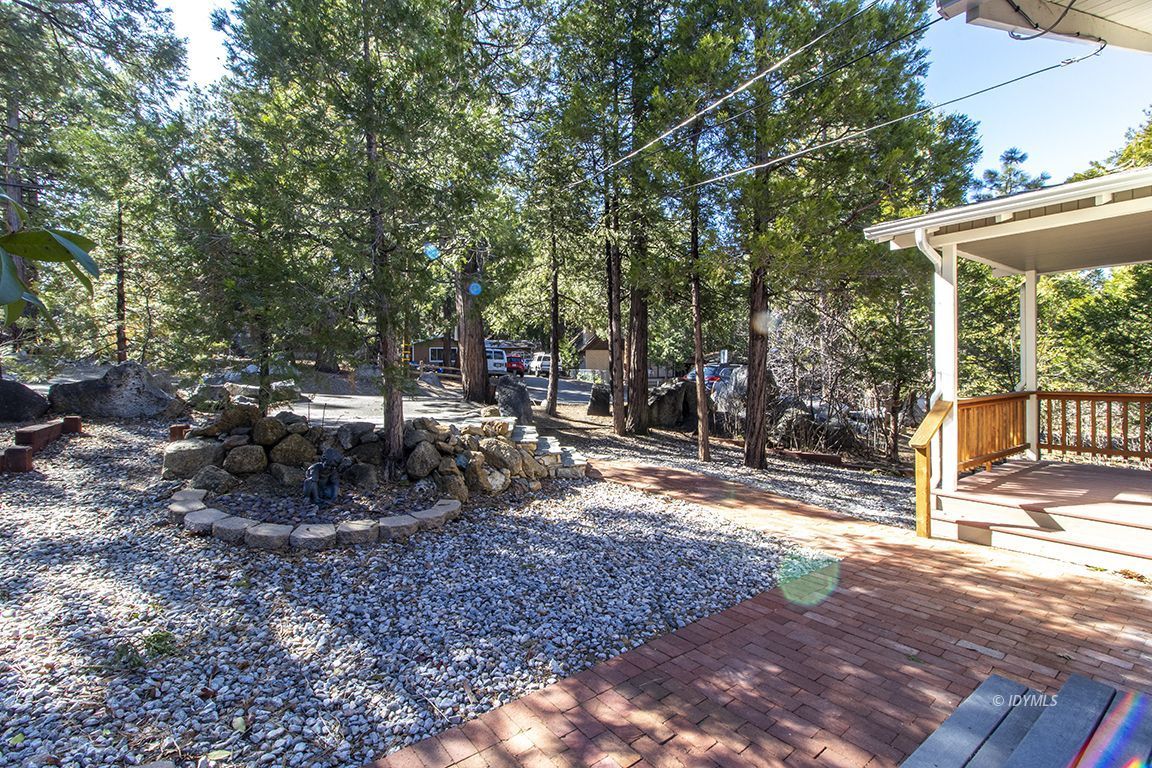 26710 Mc Mahon Road Idyllwild, CA 92549 - Photo 31 of 35 a view of a backyard with large trees and plants