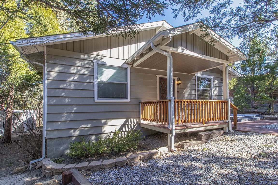 26710 Mc Mahon Road Idyllwild, CA 92549 - Photo 33 of 35 a house with a small yard and wooden fence