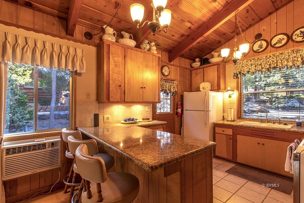 26710 Mc Mahon Road Idyllwild, CA 92549 - Photo 10 of 35 a kitchen with sink cabinets and outdoor view