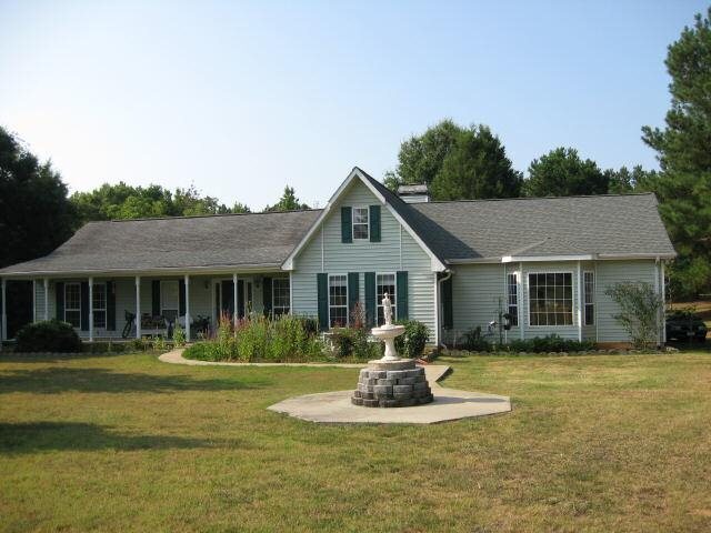 1760 Michael Road Northwest Monroe, GA 30656 - Photo 1 of 1 a front view of a house with a yard
