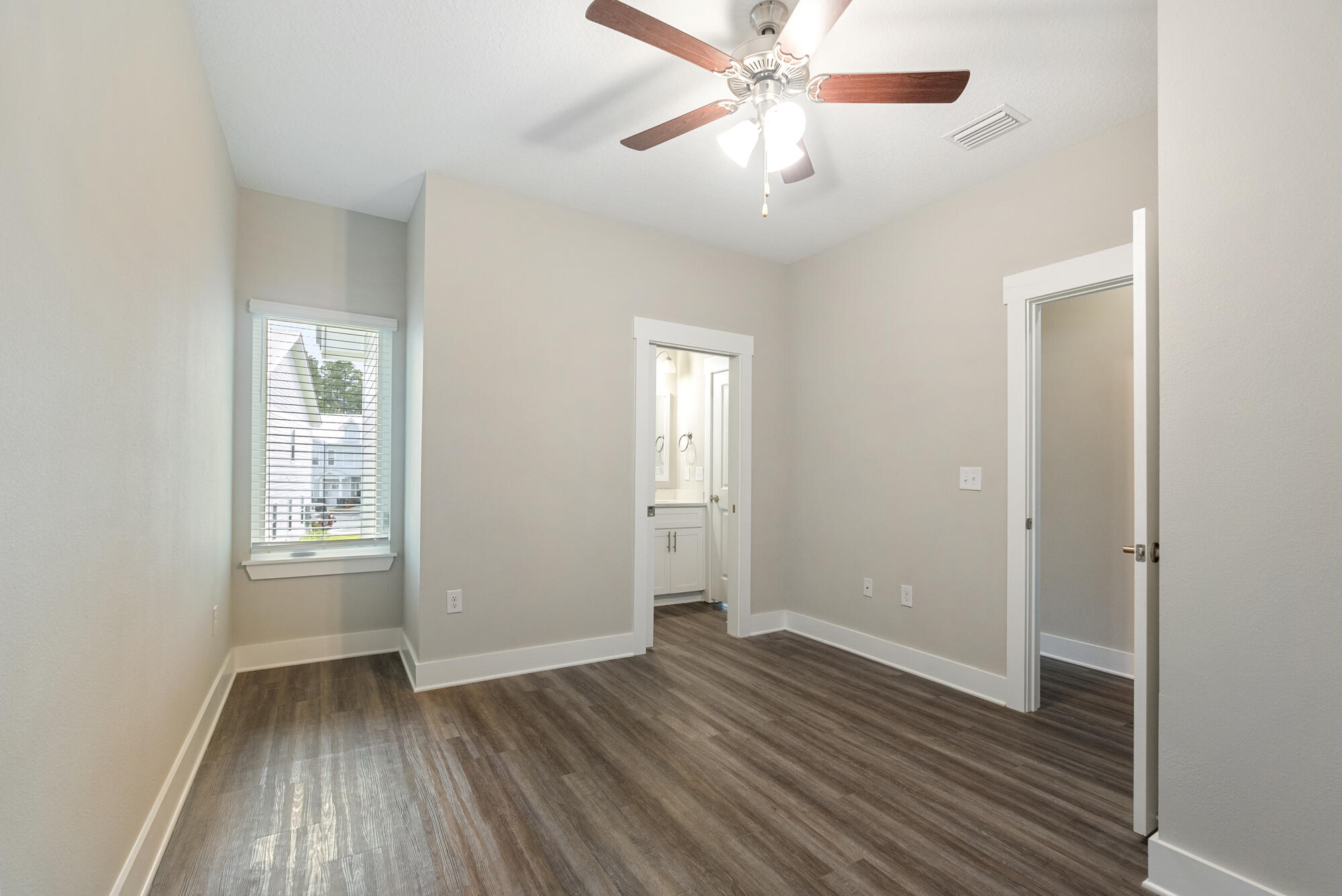 294 Date Palm Lane Freeport, FL 32439 - Photo 13 of 28 wooden floor in an empty room with a window