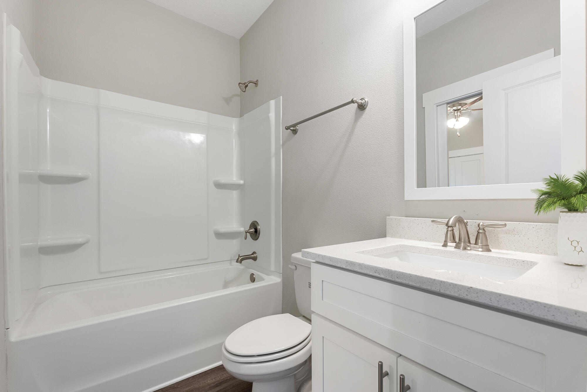 294 Date Palm Lane Freeport, FL 32439 - Photo 14 of 28 a bathroom with a sink a toilet and a bathtub