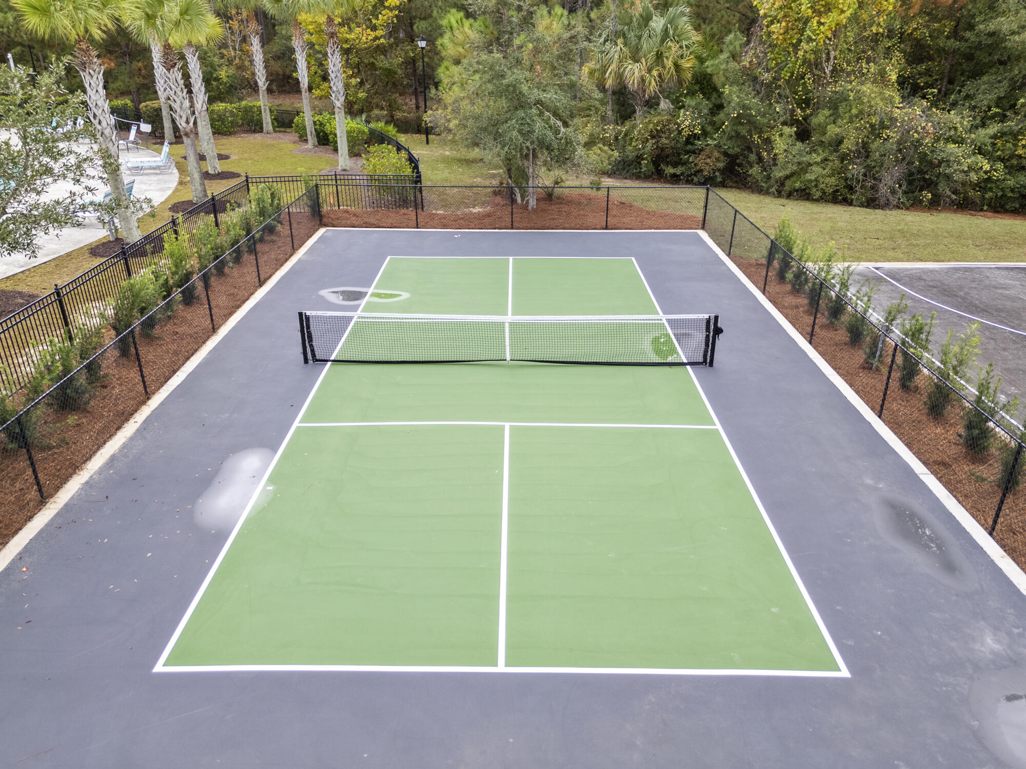294 Date Palm Lane Freeport, FL 32439 - Photo 23 of 28 a view of a tennis court