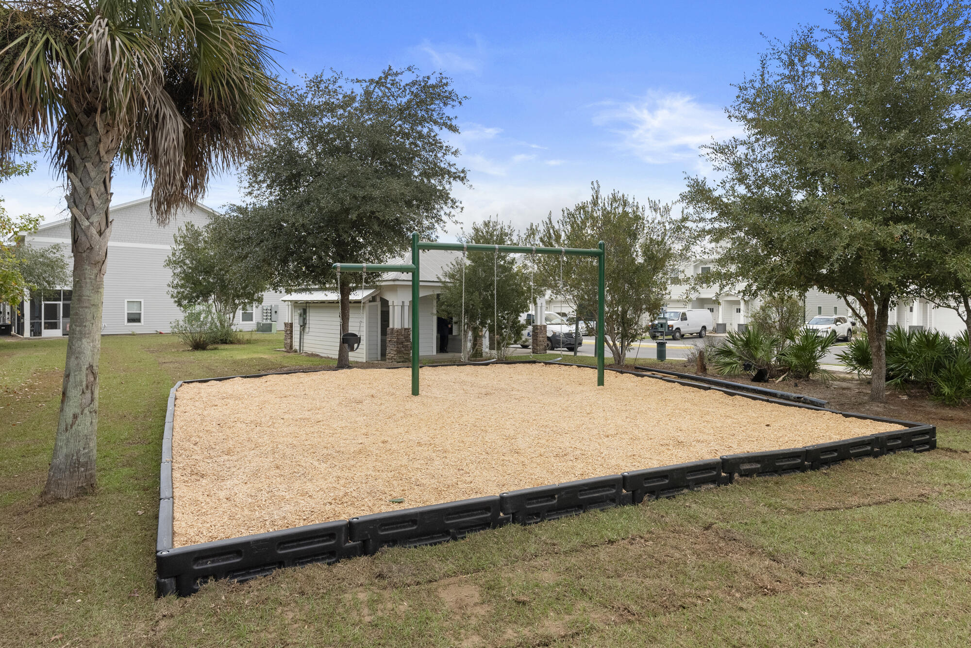 294 Date Palm Lane Freeport, FL 32439 - Photo 25 of 28 a swimming pool with a house in the background