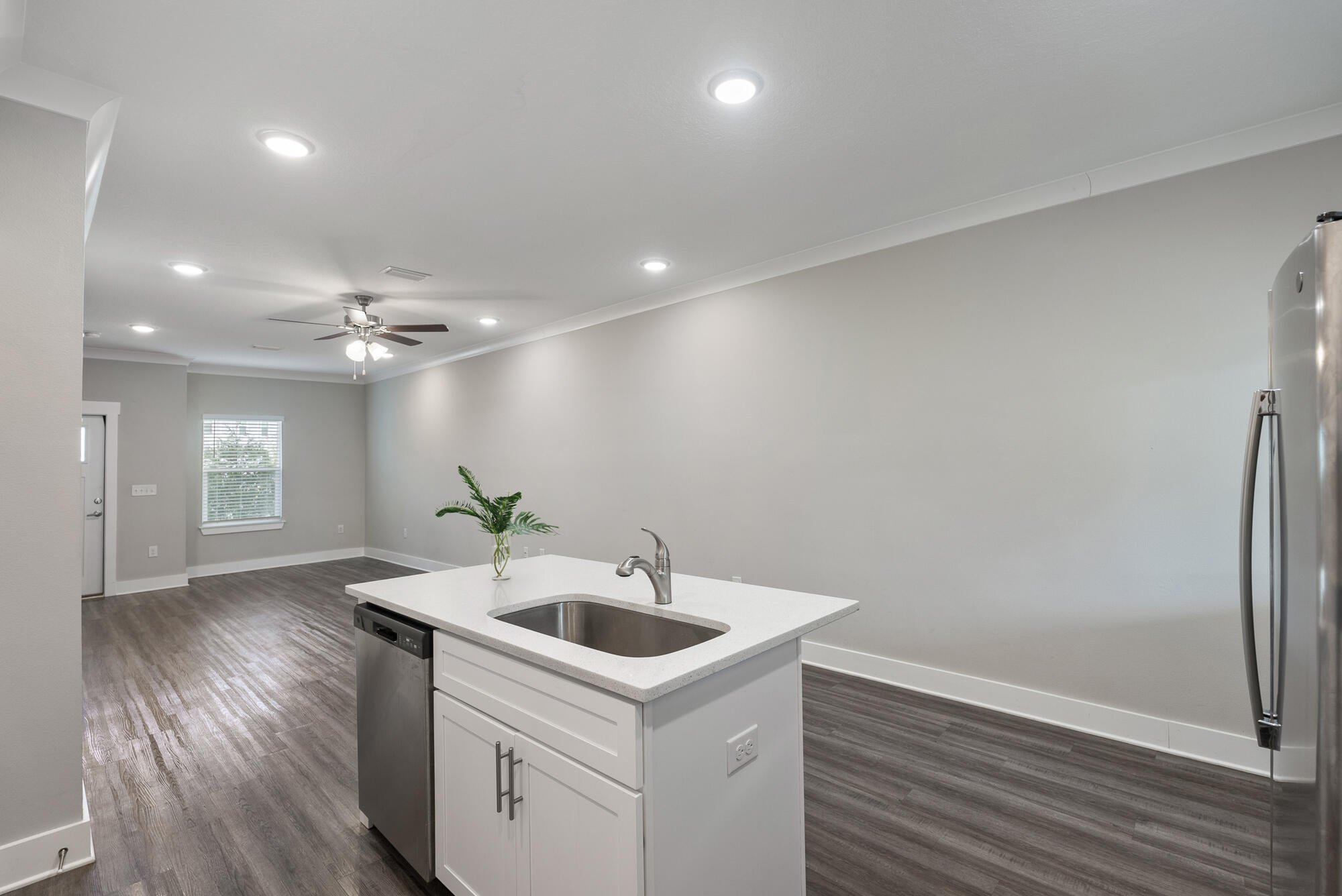294 Date Palm Lane Freeport, FL 32439 - Photo 6 of 28 a kitchen with a sink and refrigerator