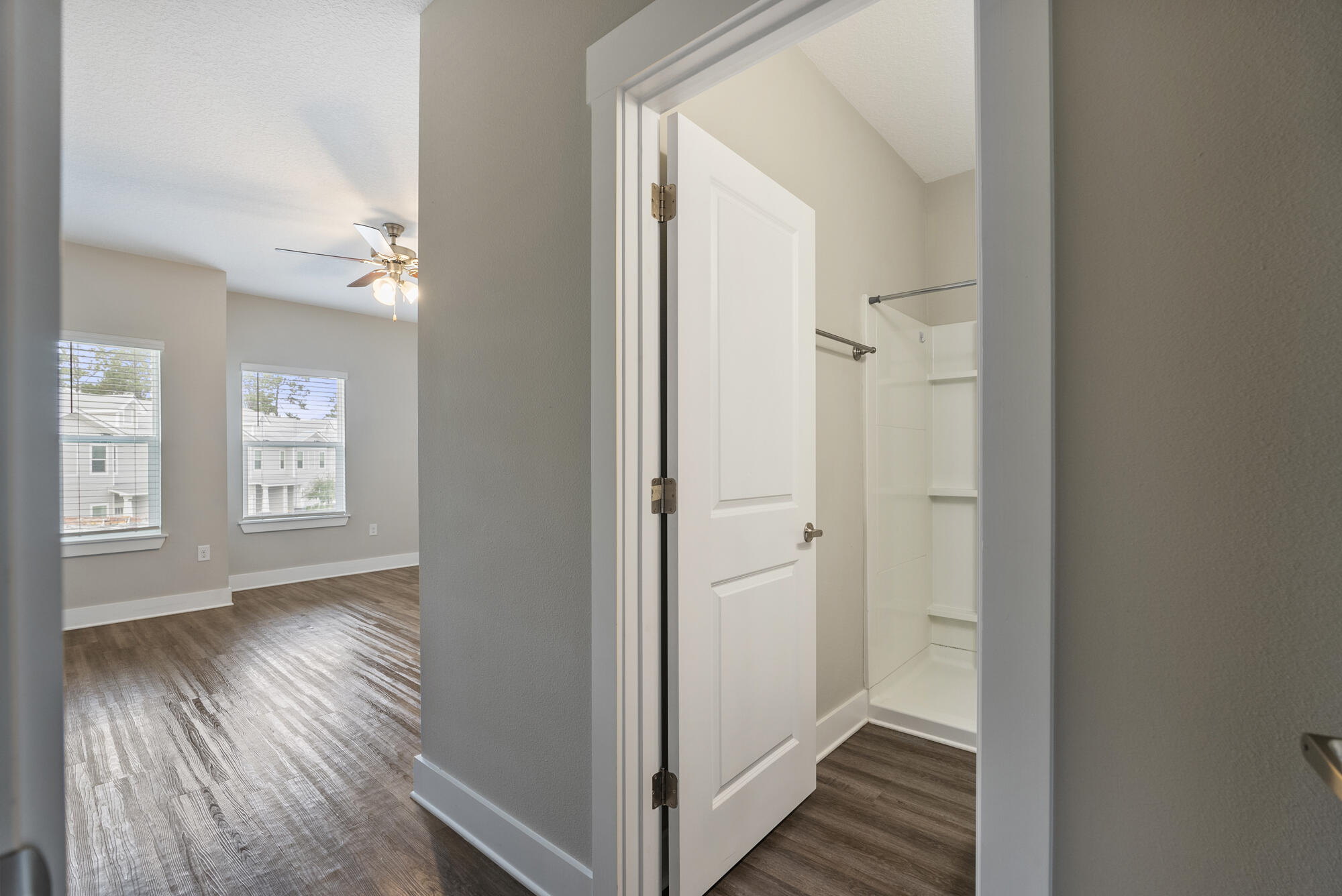 294 Date Palm Lane Freeport, FL 32439 - Photo 8 of 28 a view of a hallway with wooden floor and a bathroom