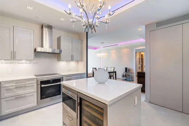 a kitchen with a sink a stove and cabinets