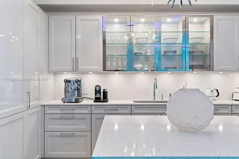a kitchen with granite countertop a cabinets and a stove