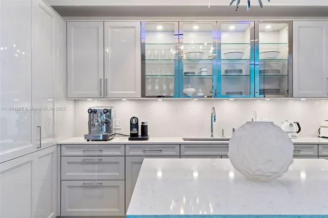 a kitchen with granite countertop a cabinets and a stove