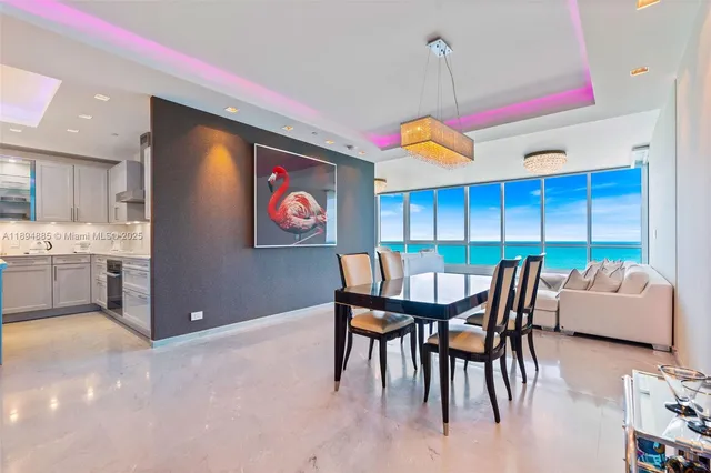 a dining room with furniture and window