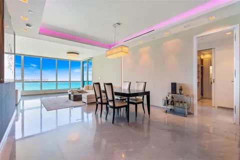 a view of a dining room with furniture and window