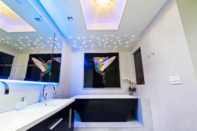 a bathroom with a sink double vanity and a mirror