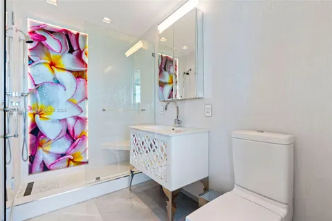 a bathroom with a sink a mirror and a bathtub