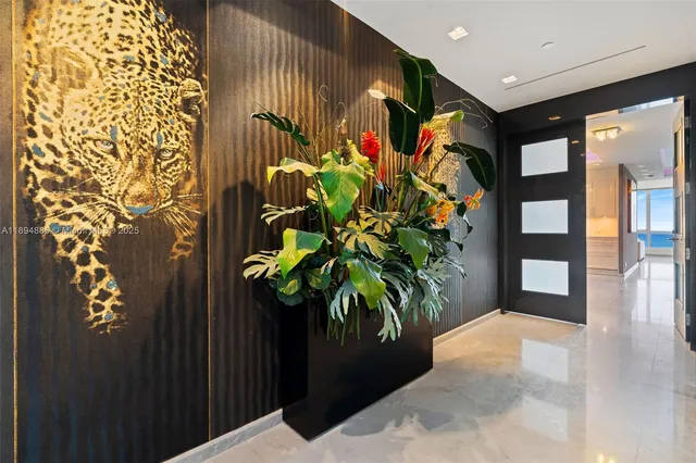 an aerial view of residential houses with outdoor space and ocean view