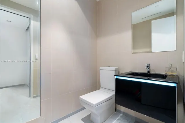 an aerial view of a house swimming pool a patio and yard