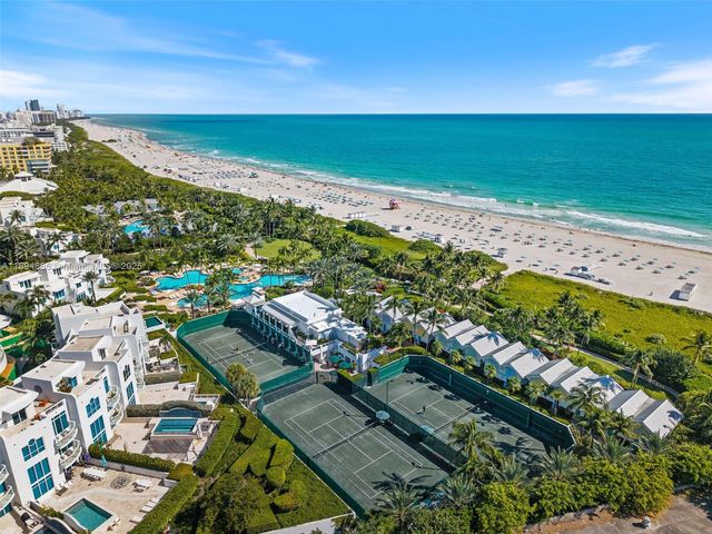 a white painted wall with lots of flowers