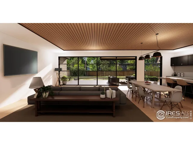 a living room with furniture tv and large window