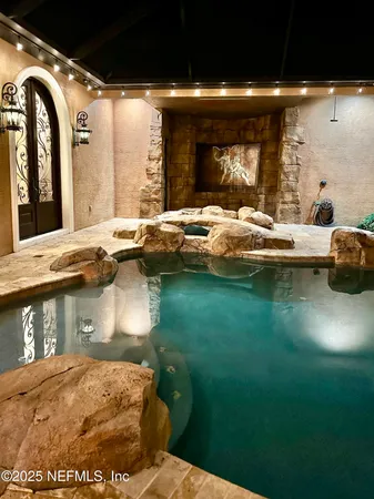 a view of a sink and a stove top oven