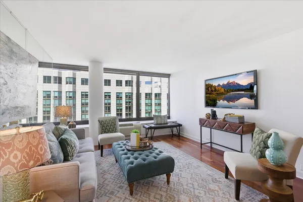 a living room with furniture and a large window