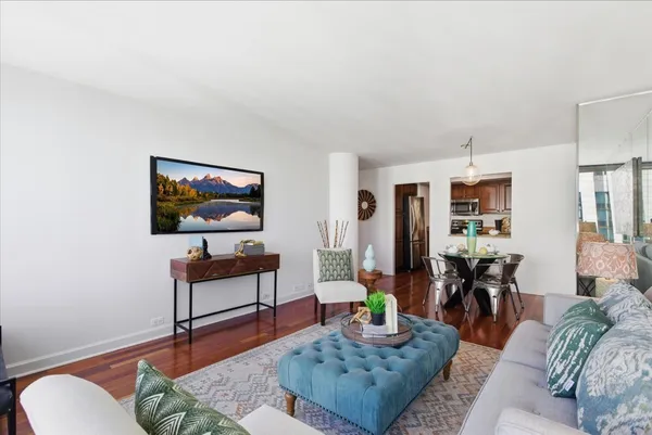 a view of a dining room with furniture and wooden floor