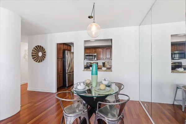 a kitchen with granite countertop wooden cabinets and stainless steel appliances